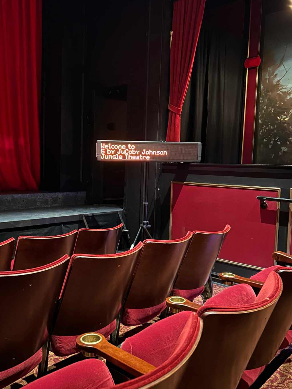 A sign for the play "5" at the Jungle Theater by JuCoby Johnson