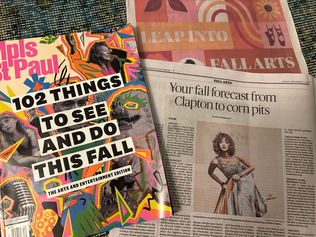 A copy of Mpls.St.Paul Magazine next to a copy of the Minnesota Star Tribune on a green rug